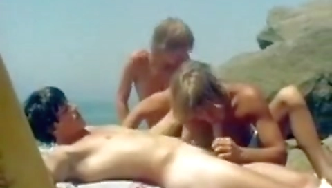 Mady and black guy on the beach